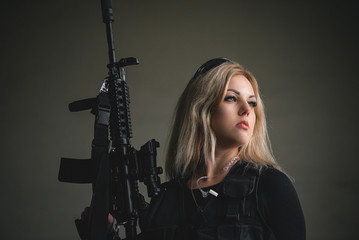 Fototapeta premium Special force agent girl with a rifle concept.