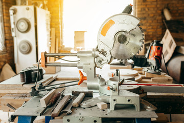 Sliding compound mitre saw in carpentry