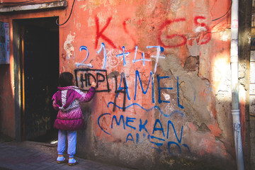 young girl with graffiti