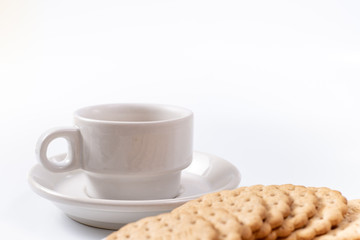 Fototapeta na wymiar white cup of coffee with cookies on background