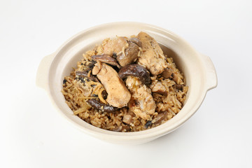 Clay pot chicken rice with mushroom in clay ceramic bowl on white background