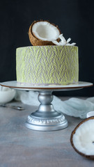 Fototapeta premium Delicious cake with coconut and pieces of pineapple inside.