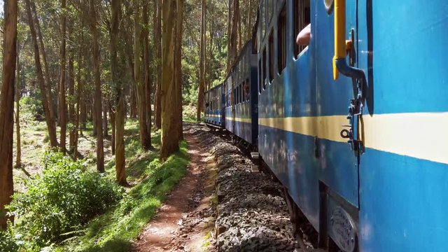 Coonoor, Tamil Nadu, India. Nilgiri mountain railway, runs between Mettupalayam and Udagamandalam in south India. Beautiful view from the moving train.