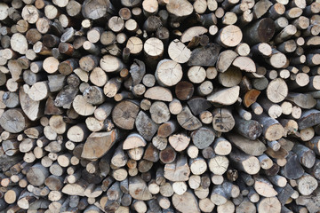Pile of chopped fire wood prepared for winter. Preparation of firewood for the winter.