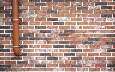 Pipe and brick wall. Textured vintage and grunge brick wall. Urban architecture concept photo.