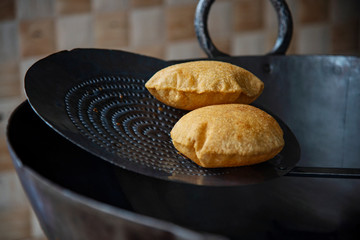 Frying fresh puri
