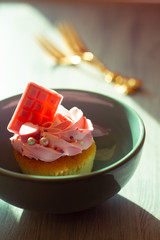 Vintage composition with dessert and gold fork on wooden background