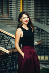 beautiful and stylish girl on a walk in the city