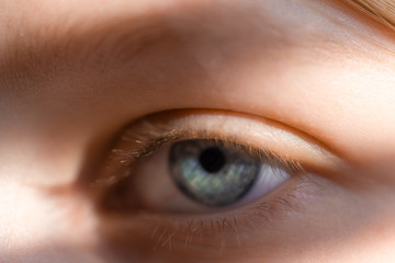 young girl shooting close up, face, face, eye, light falls on the face