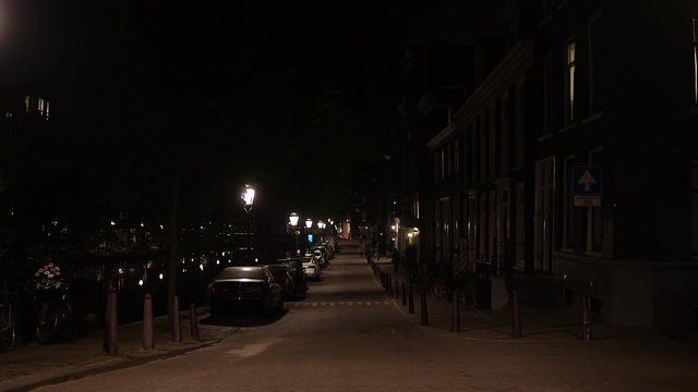 Deserted canal in Amsterdam at night during corona crisis. Netherlands.