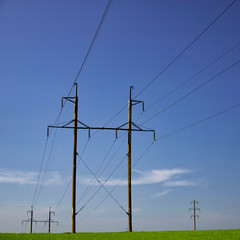 The clouds over the power lines are magnificent.Power lines and sky with clouds.Powerful lines of electric gears.Electric power industry and nature concept.High voltage power lines.