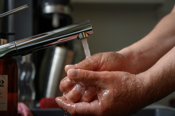 Close-up of the washing hands against Covid-19