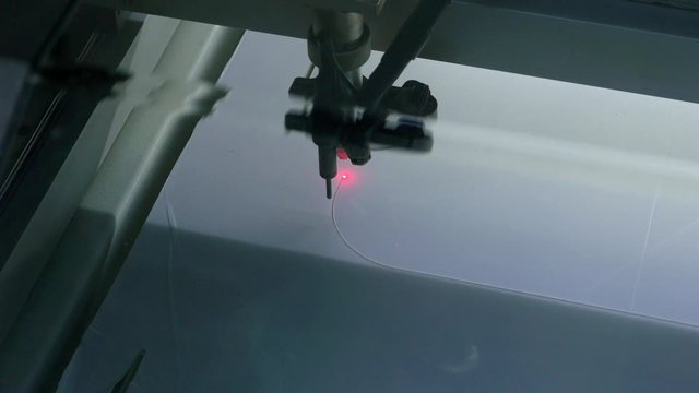 Covid 19, cutting plexiglas for social distancing in shops and public places