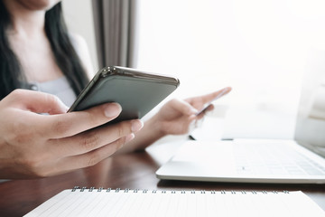 Fototapeta premium Online payment.woman's hands holding smartphone and using credit card for online shopping. Cyber Monday Concept