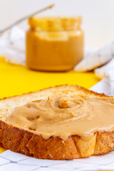 Appetizing peanut paste butter sandwich. Close up.