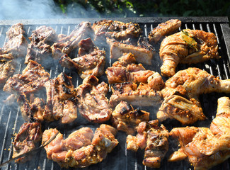 Meat on the grill. Chef cooking grilling mix of fresh grilled chicken meat