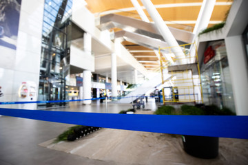 space is surrounded by a blue ribbon for repair and decoration. restrictive tape at the airport.