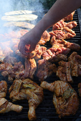 Meat on the grill. Chef cooking grilling mix of fresh grilled chicken meat