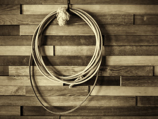 Wild West style restaurant and cowboy. On the wall is a shepherd's lasso. Picture taken in Ukraine,...