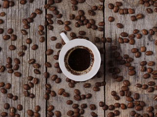 cup of coffee on a wooden background