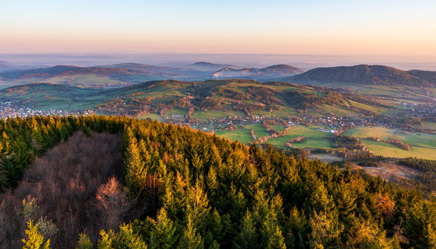 sunrise in the valley of a beautiful green field in spring with fog, Czech Beskydy Frenstat pod Radhostem