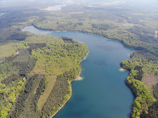 Aerial view of crystal clear Peetschsee located in Stechlin conservation area, Brandenburg Germany