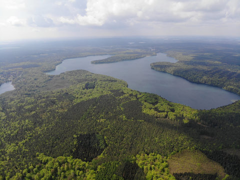Aerial view of crystal clear Peetschsee located in Stechlin conservation area, Brandenburg Germany