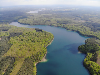 Aerial view of crystal clear Peetschsee located in Stechlin conservation area, Brandenburg Germany