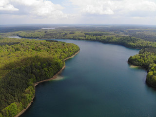 Aerial view of crystal clear Peetschsee located in Stechlin conservation area, Brandenburg Germany
