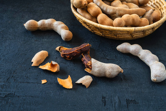Tamarind in a wooden basket on the table