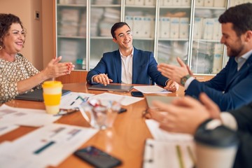 Business lawyers workers meeting at law firm office. Professional executive partners working on finance strategry at the workplace. Clapping to each other for successful achievement.