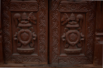 Fototapeta na wymiar Details at Swayambhunath Temple Complex - Buddhist Center and Village on the Outskirts of Kathmandu in Nepal
