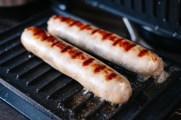 Grilled pork and beef sausages. Close the barbecue at home.