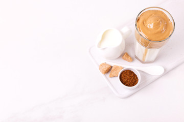 whipped dalgona coffee with milk and cane sugar. South Korean summer drink