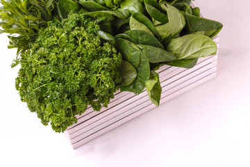 parsley, dill, spinach, thyme, mint, estragon, basil - green fresh garden herbs in wooden box