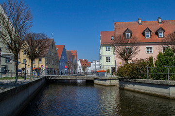 Fototapeta na wymiar river between houses in the city of Memmingen in Germany