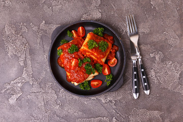 traditional Mexican cuisine chimichanga. Corn cake with minced meat, pepper, onion, garlic, oregano and marinara sauce