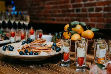 Snacks at the buffet - cheese, grapes, tomatoes, olives - catering