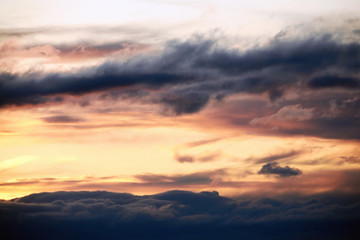 Beautiful landscape of orange evening sunset in the sky with clouds. The concept of the natural environment