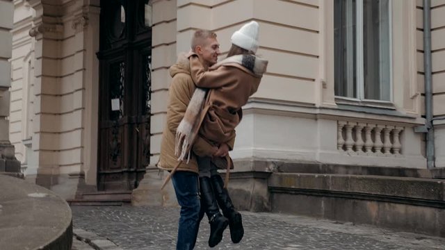 Beautiful young girl with her boyfriend near old castle