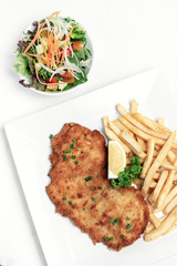 german breaded pork schnitzel with french fries