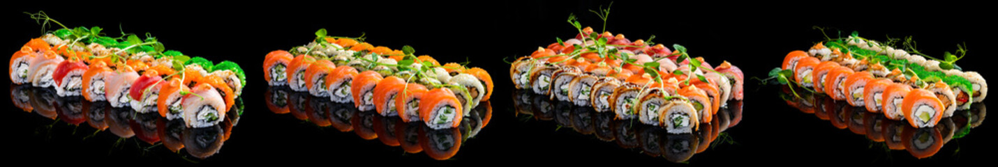 Large set of japanese rolls on a black plastic plate