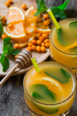 Sea buckthorn lemonade with oranges and mint.