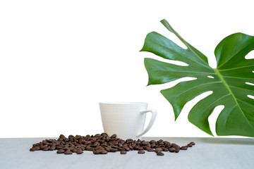 Cup Coffee, roasted coffee bean, monstera leaf  isolated on white background.
