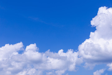 Fototapeta na wymiar Blue sky background with white clouds on sunny day