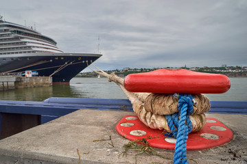 cruise ships are moored in Quebec City with the St. Lawrence River in the background.