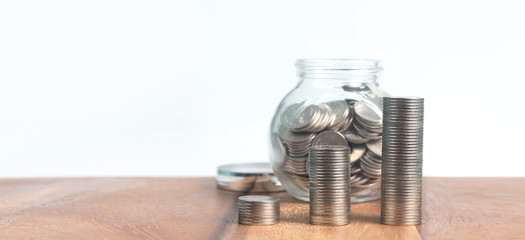 Glass piggy bank with home in saving money concept