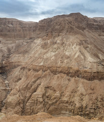 Rocky cliff of the mountain with a narrow path on it.