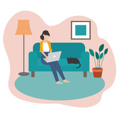 Freelance woman sitting on the sofa using laptop to working at home