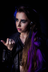 Girl in werewolf style on a black background with blue light.